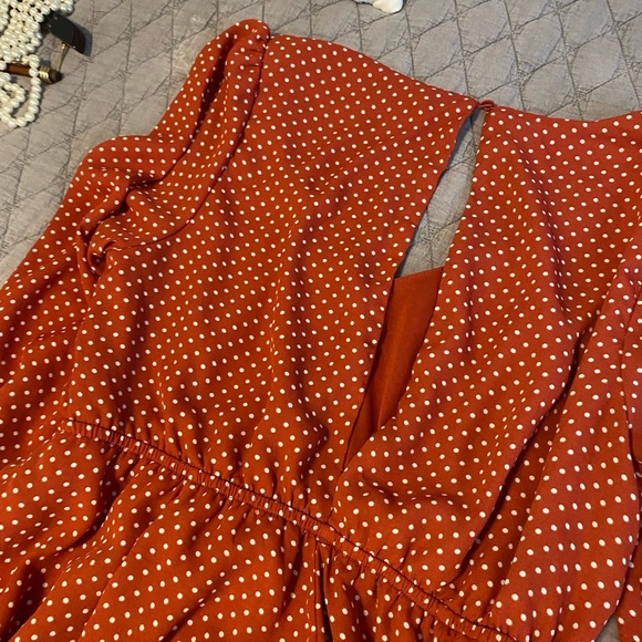 This is a mini burnt orange dress with white polka dots. Open back. - Picture 2 of 3